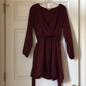 A long sleeve, maroon Charlotte Rouse dress.